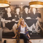 woman in front of boutique