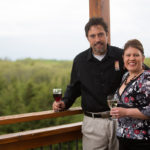 man and woman with a glass of wine