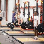 young men lifting weights