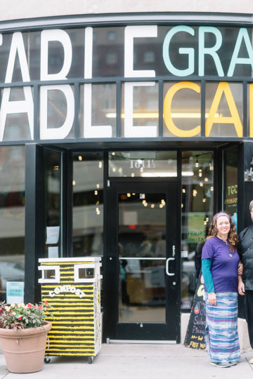 man and woman outside cafe