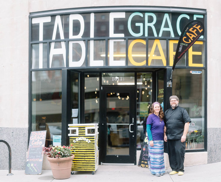 man and woman outside cafe