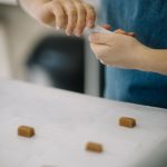 woman making candy