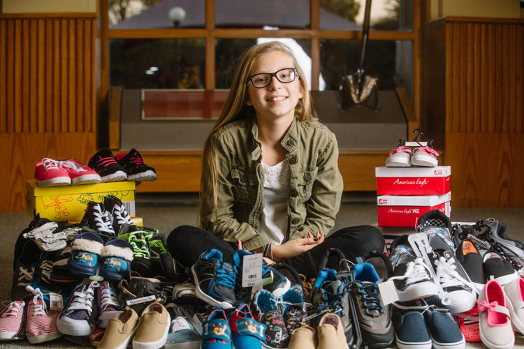 young girl with lots of shoes
