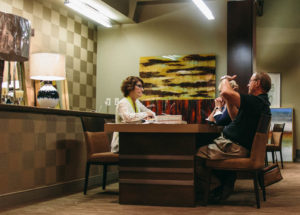 two women and man at table