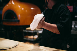 chef with pizza dough
