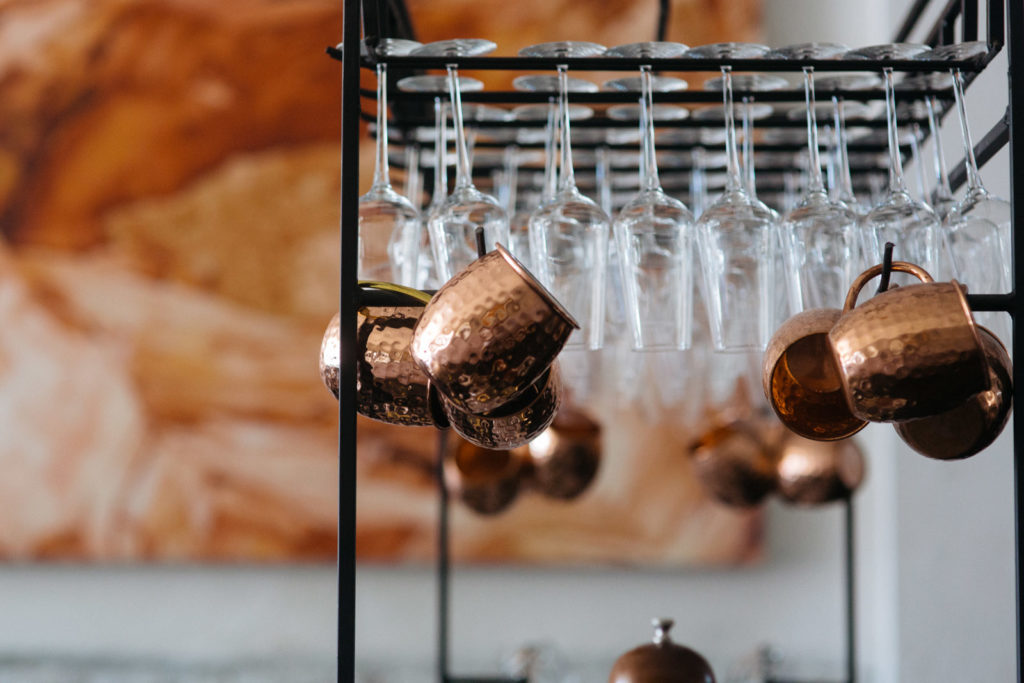 wine glasses and copper mugs