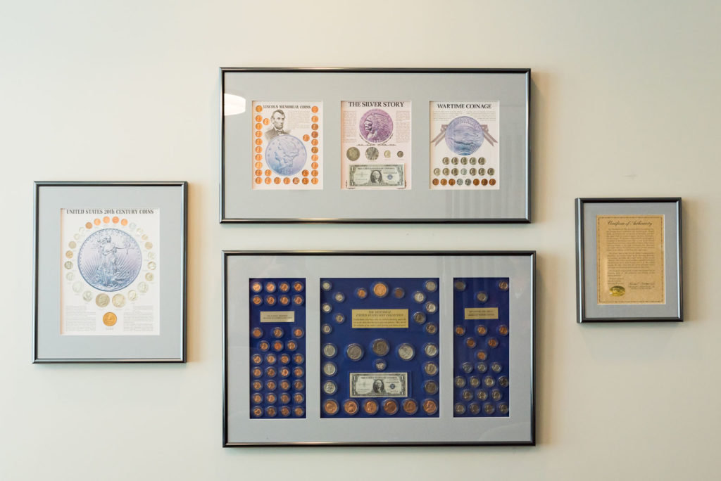 coin collections hung on wall
