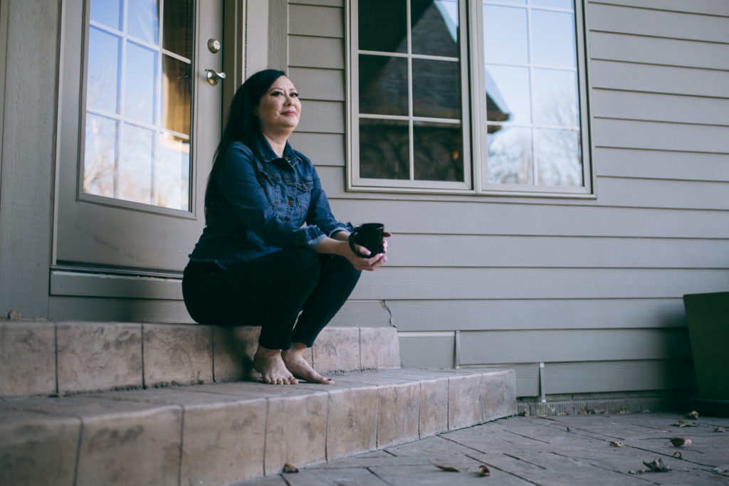woman sitting on steps
