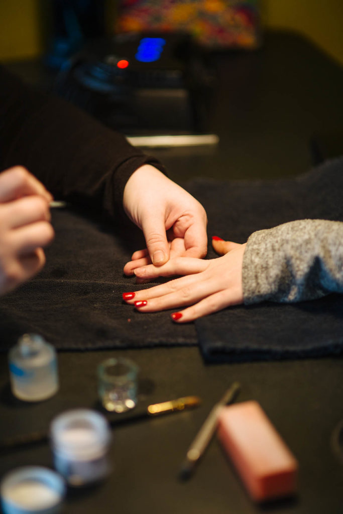 woman getting her nails done