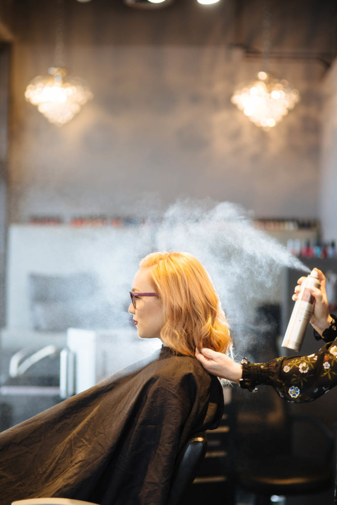 woman getting her hair cut