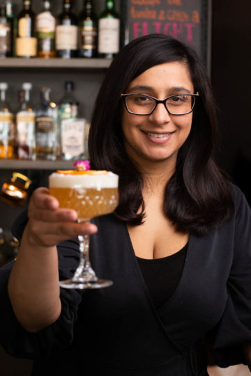 woman bartender with cocktail