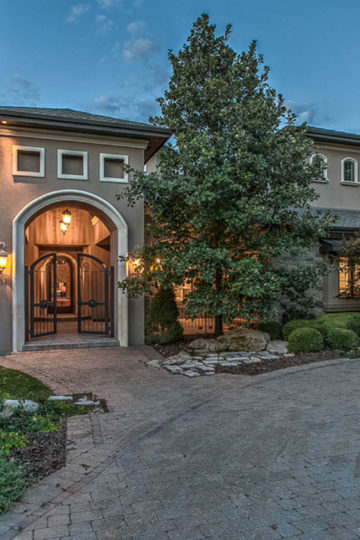 home with paver driveway