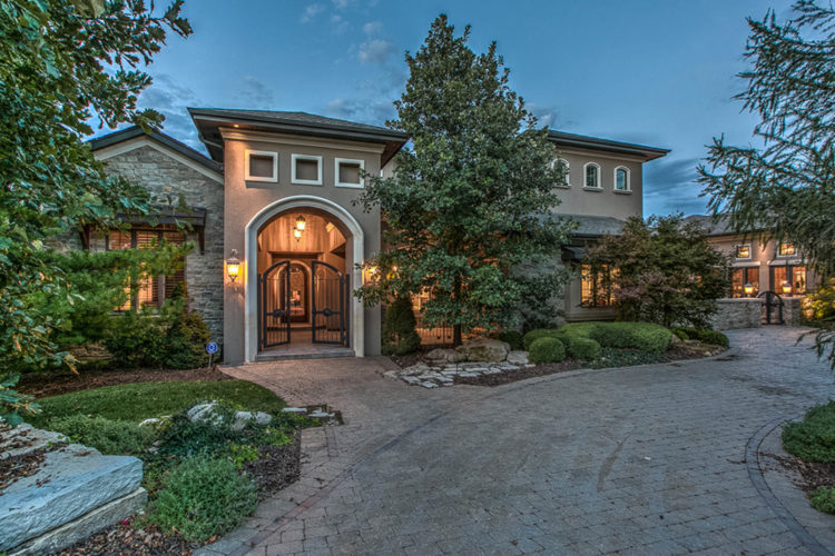 home with paver driveway