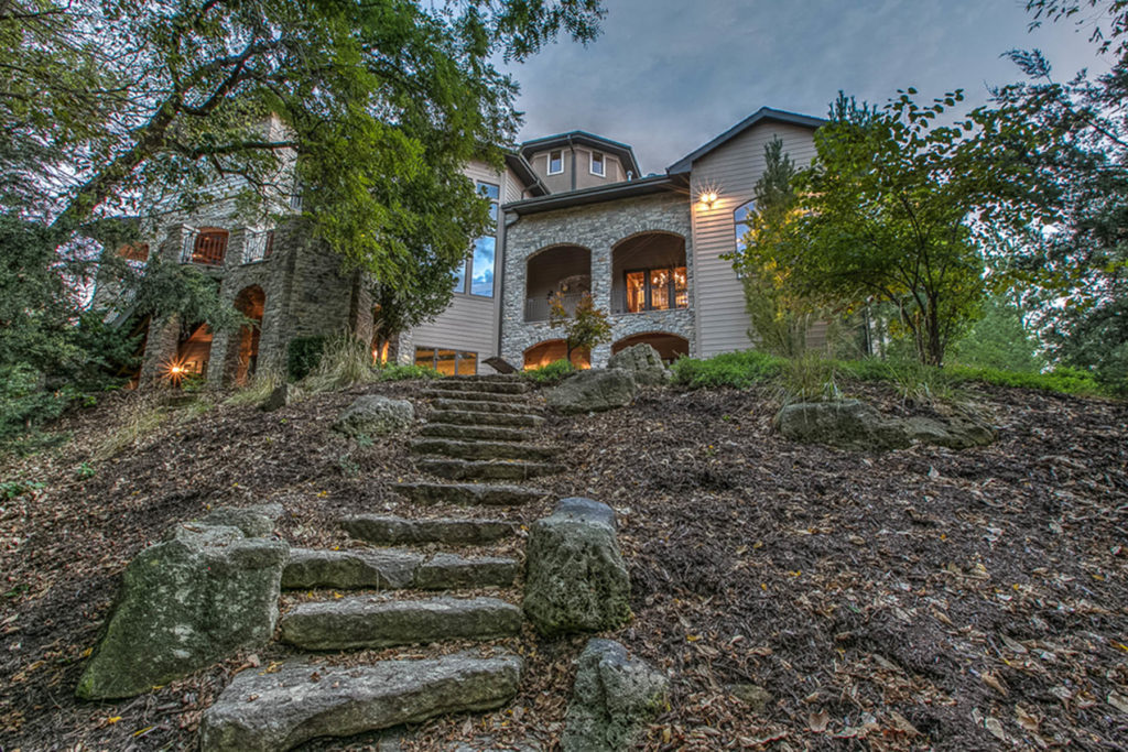 house with rock steps leading up to it