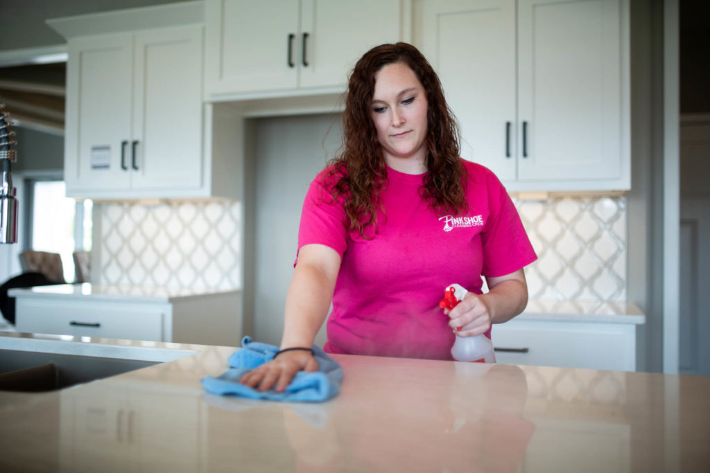 woman cleaning kitchen