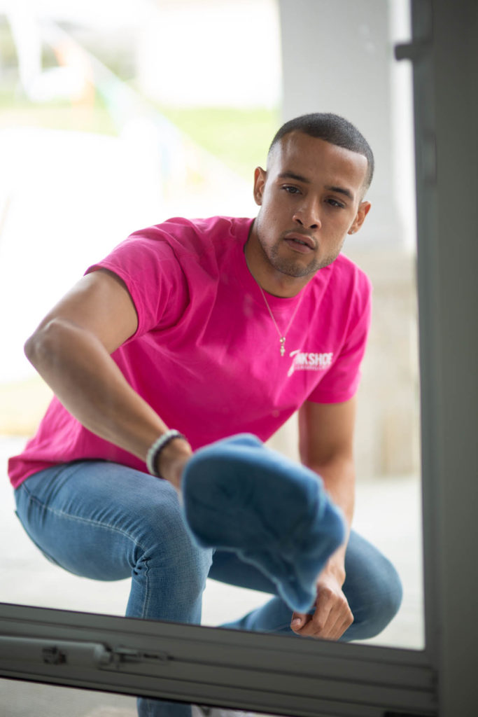 man cleaning window