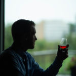 man with a bourbon drink