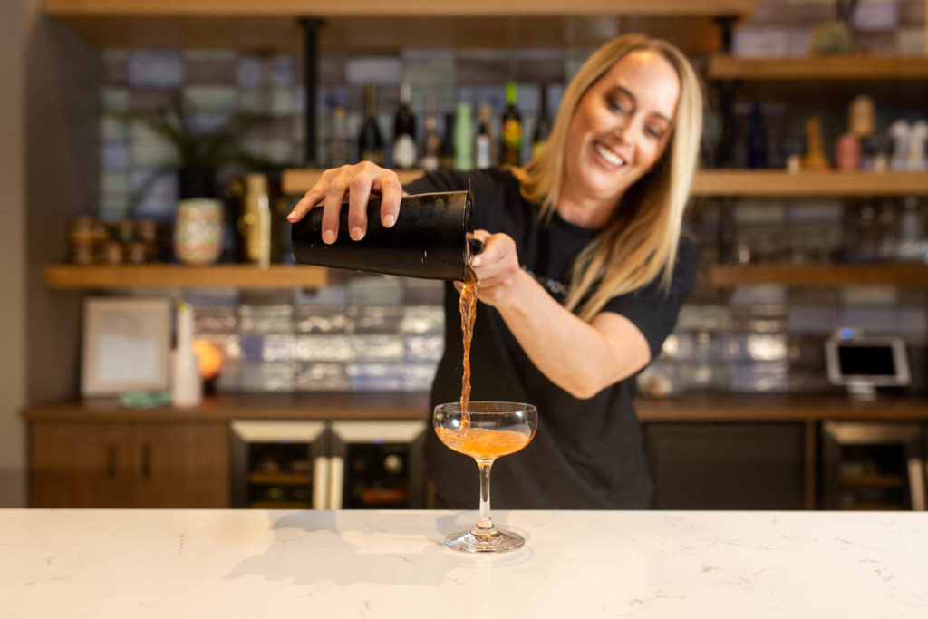 bartender pouring cocktail