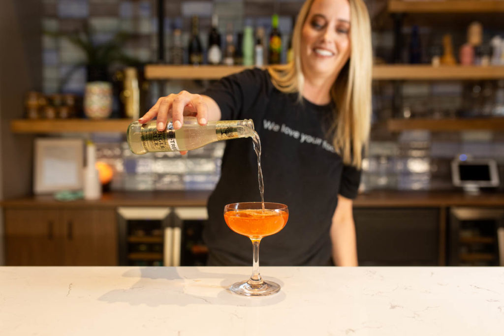 bartender pouring cocktail