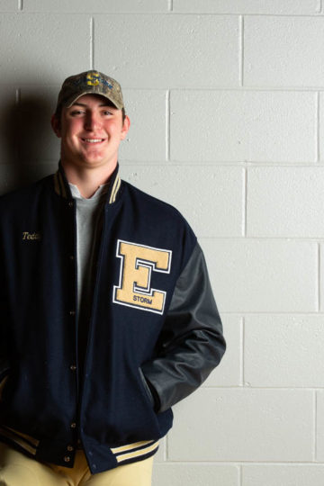 young male in letterman's jacket