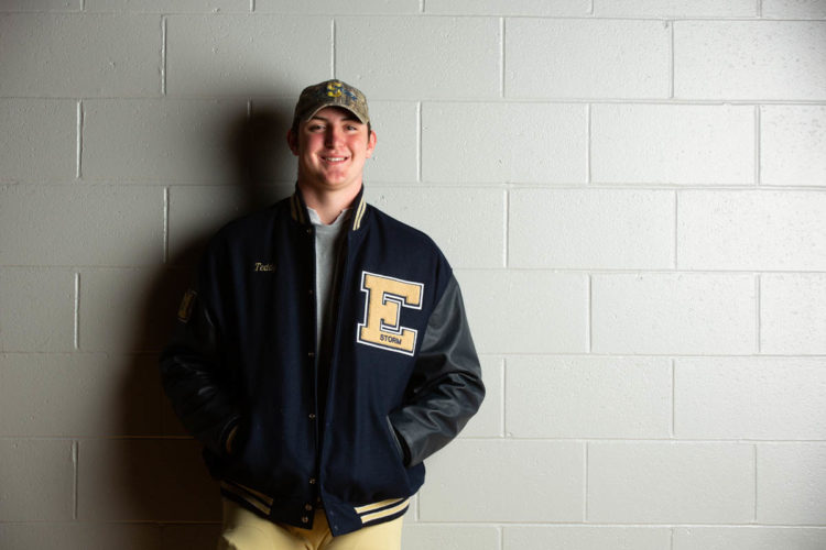 young male in letterman's jacket
