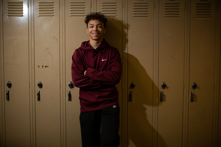 young man in front of lockers