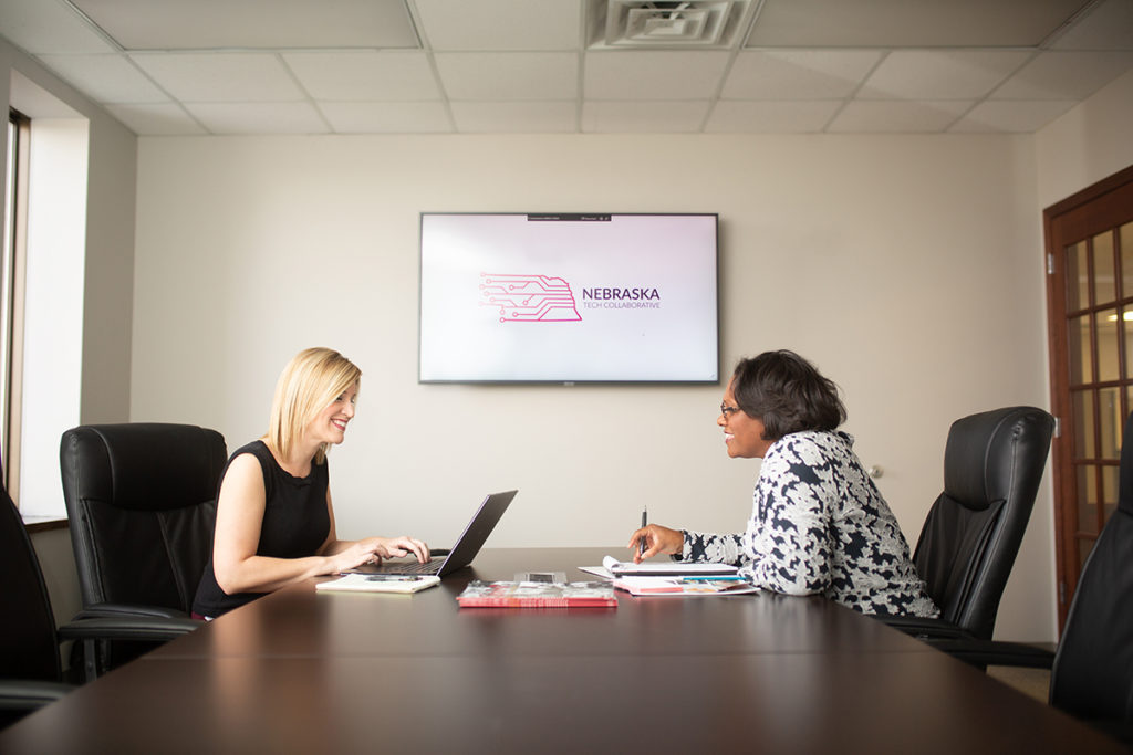 two women at conference table
