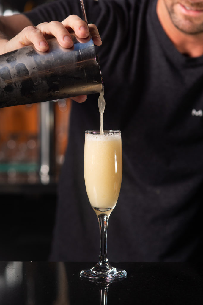 bartender pouring cocktail