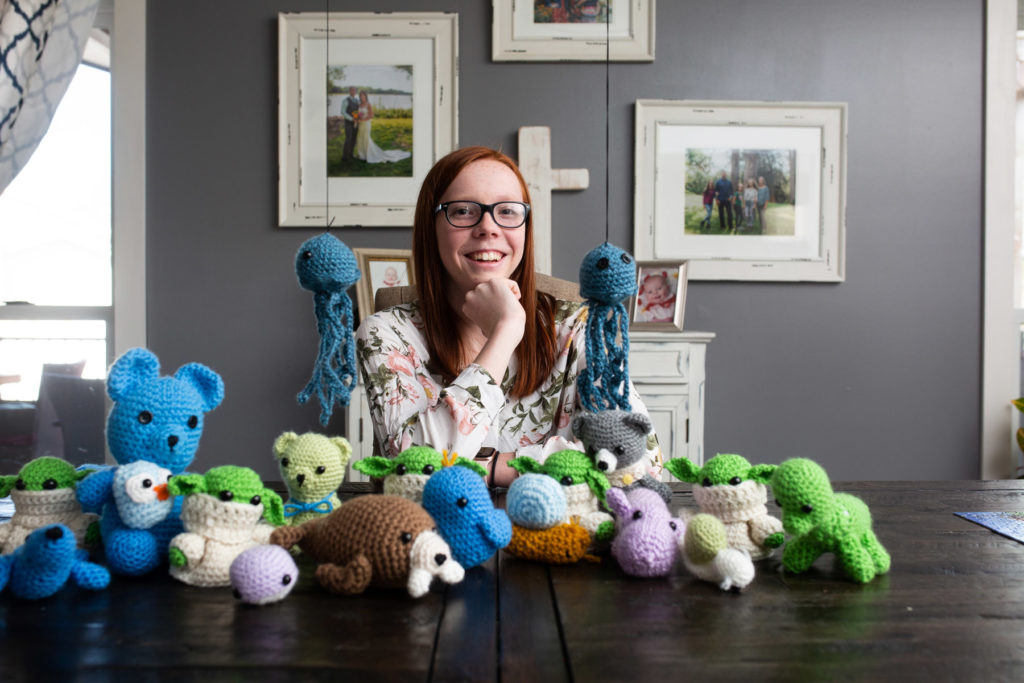 woman with yarn animals