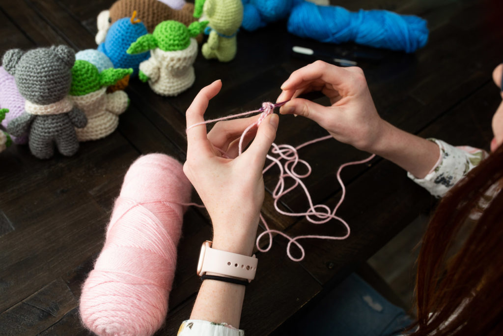 woman crocheting