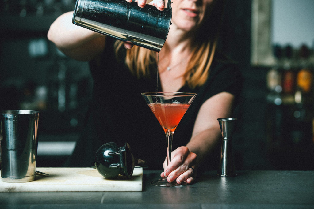 bartender pouring cocktail