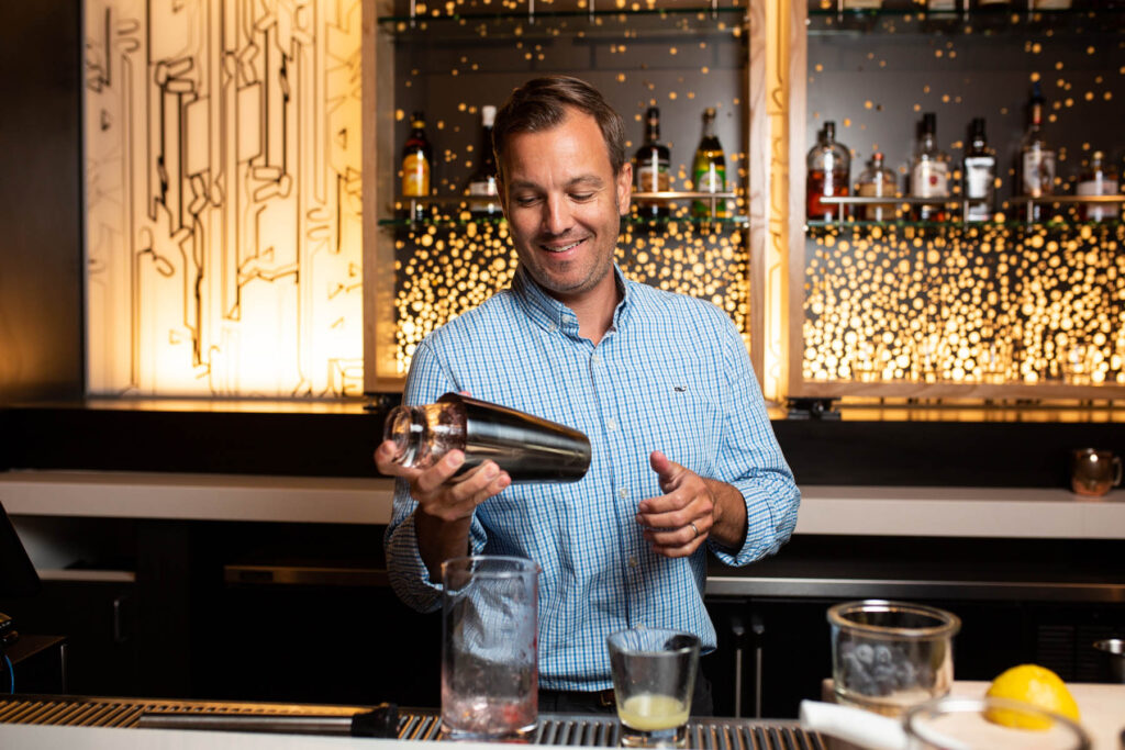 bartender with cocktail shaker in hand