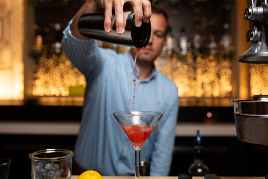bartender pouring cocktail