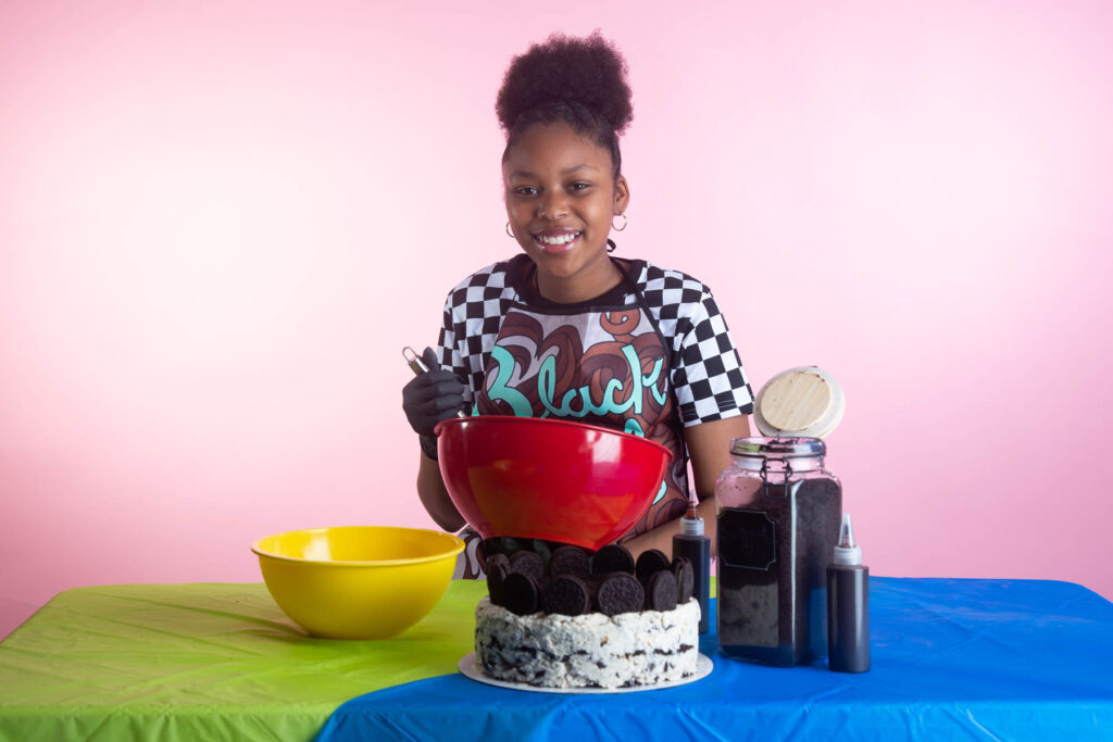 young lady making a cake