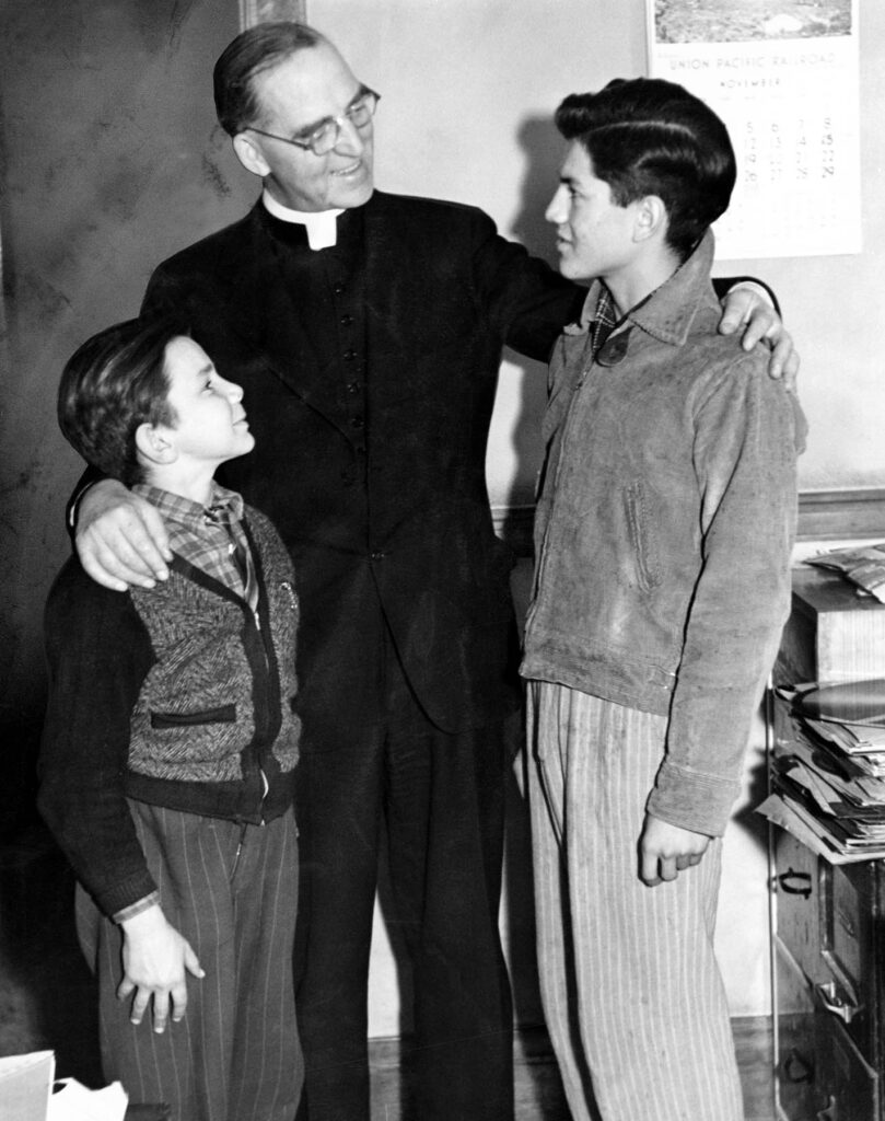 priest with children