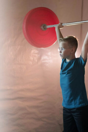 boy lifting weights
