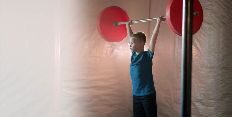 boy lifting weights