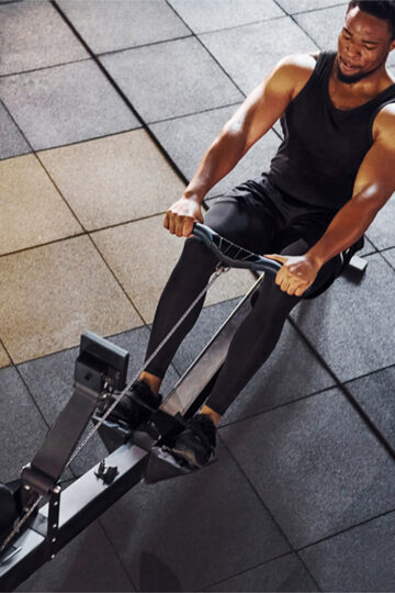 man on rowing machine
