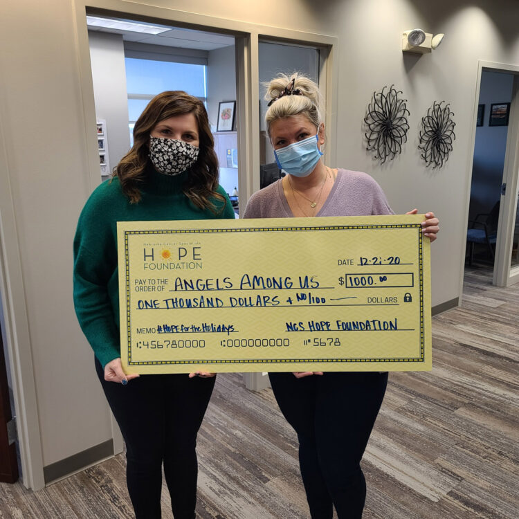 women holding check