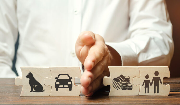 man's hand with wooden puzzle