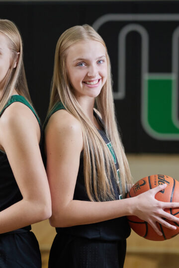 sisters with basketballs