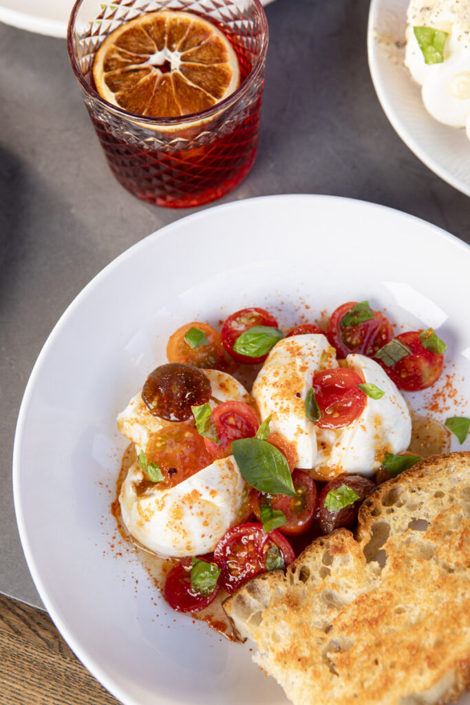 26 September 2025– Cattle Call is photographed for dining feature in Omaha Magazine. Owner, Rocky, is photographed, along with executive chef Abraham Vidaurre. DIshes photographed include: cream puff, burrata, yellowfin tuna, and chicken breast.